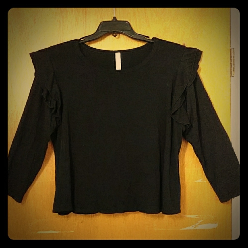 Long sleeve top with ruffled shoulders